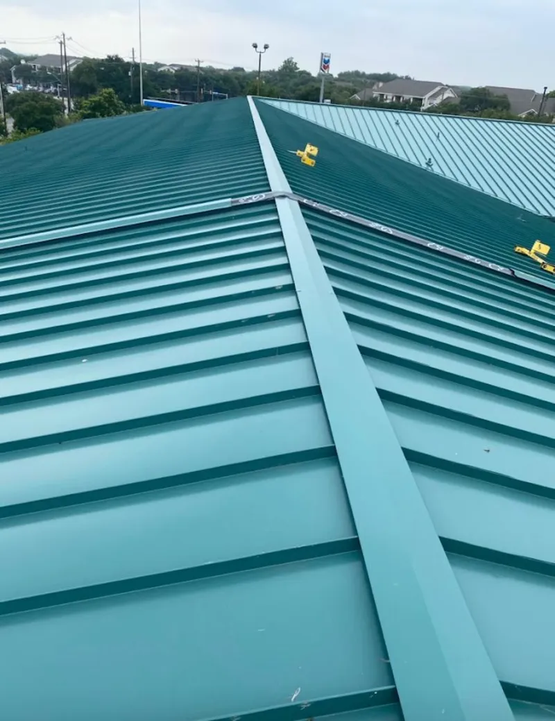 Green commercial metal roof ridge and valley for Metal Roof Repair in Royalton
